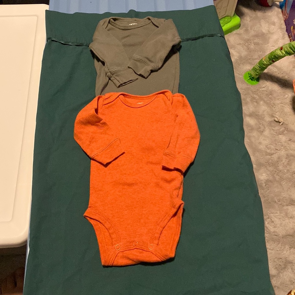 Orange and dark green long sleeve onesie